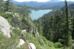 Red lake. At the base of the ladder. The pioneers camped around the lake, resting and dissembling their wagons to get ready for the long 3/4 mile ascent to the summit. Records show there were often 50,000 migrants a month coming over the Carson Pass. This photo shows some of the steepness they had to traverse. Oxen often fell to their knees, bruised and battered and bloody they made trip after trip.